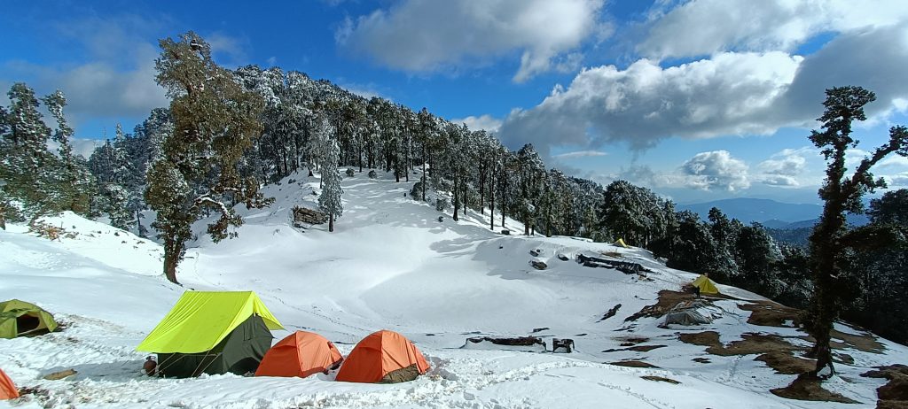 Snowy landscape with colorful tents